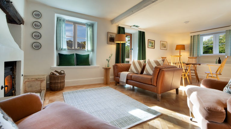 The open-plan sitting and dining room at Woody's Cottage, Gloucestershire